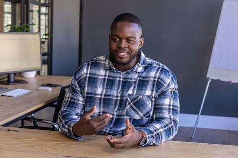 Confident Professional Communicating in Modern Office Setting