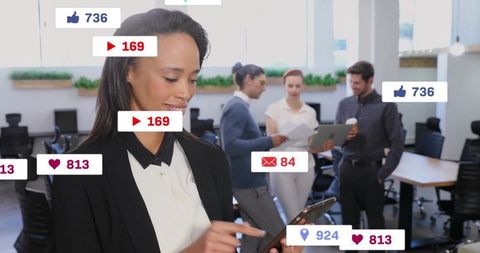 Businesswoman Engaging with Digital Media Icons in Modern Office