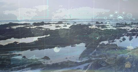 Digital world map overlay on rocky shoreline at low tide