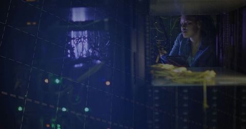 IT technician inspecting server rack with tablet, neon network monitoring overlay, data center opera