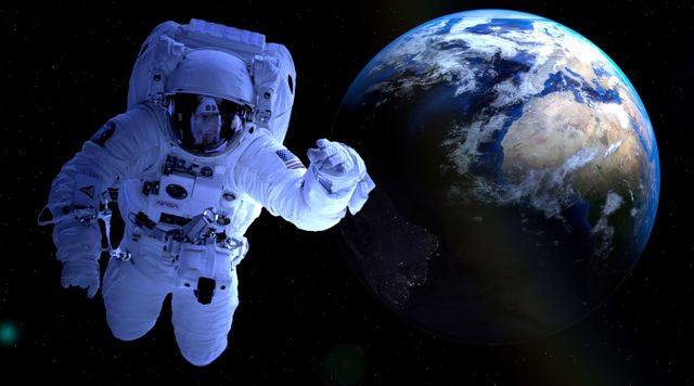 Astronaut floating in outer space with Earth's vibrant continents and oceans visible in the background. Ideal for themes related to space exploration, NASA missions, science fiction, and universe education. This can be used for educational materials, science articles, or promotional content for space-related events.