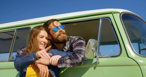 Couple Enjoying Adventure in Vintage Van Under Sunny Sky - Download Free Stock Images Pikwizard.com