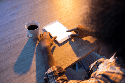 Male Professional Using Tablet with Coffee on Transparent Office Desk - Download Free Stock Videos Pikwizard.com