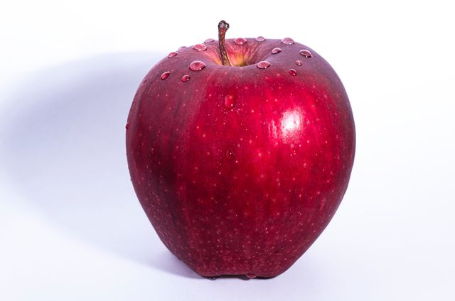 Fresh Red Apple with Water Droplets on White Background - Download Free Stock Photos Pikwizard.com