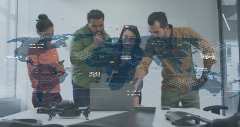 Multidisciplinary team analyzing global drone data with interactive holographic map
