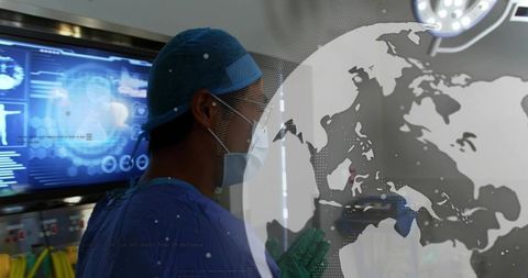 Surgeon studying augmented reality globe and diagnostic display in modern operating room