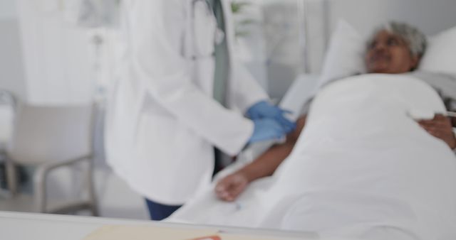 Nurse taking care of elderly patient in hospital bed - Download Free Stock Images Pikwizard.com