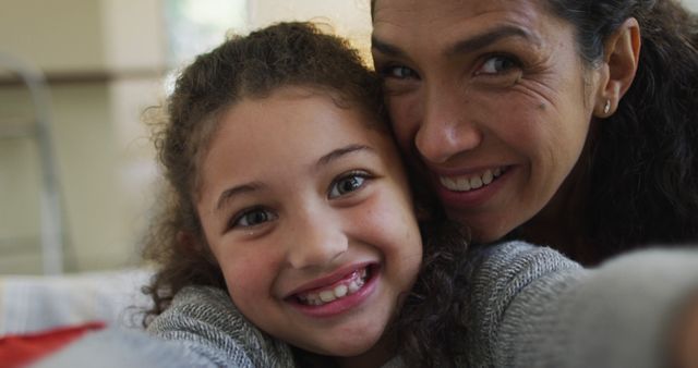 Smiling Mother and Daughter Taking Selfie at Home - Download Free Stock Photos Pikwizard.com