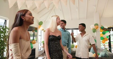 Friends Decorating for Birthday Party Celebration at Home