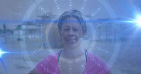 Female athlete standing in urban plaza showing augmented reality hud with blue lens flares