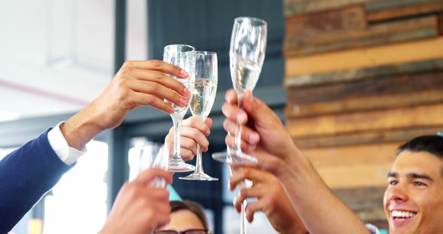 Group of Friends Cheering with Champagne Glasses - Download Free Stock Images Pikwizard.com