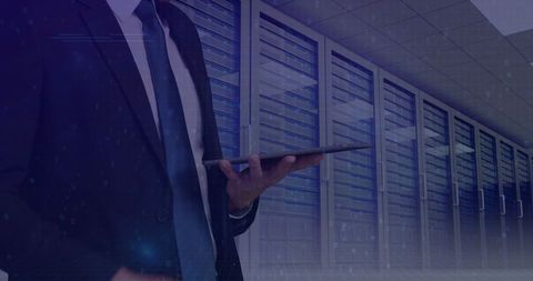 Businessman Using Tablet in Modern Data Center