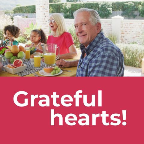 Multigenerational Family Enjoying Thanksgiving Meal Outdoors