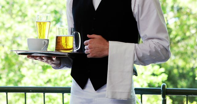Waiter Serving Drinks on Sunny Day - Download Free Stock Images Pikwizard.com