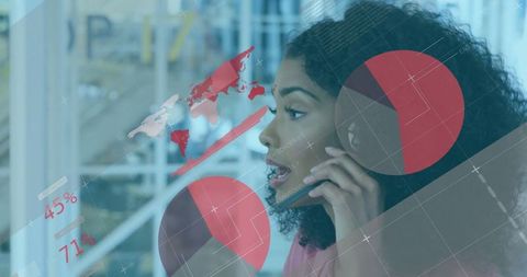 Businesswoman Analyzing Data with Phone and Charts in Office