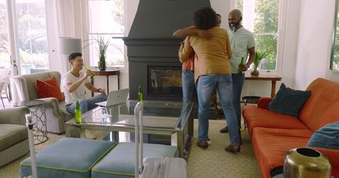 Friends Bonding and Socializing Around Laptop in Cozy Living Room