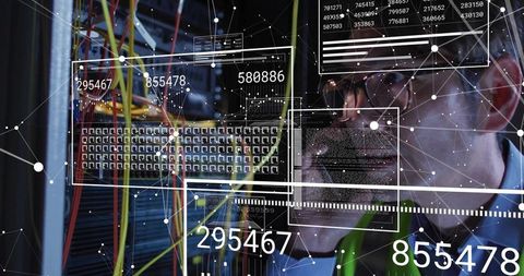 Technician Monitoring Data Center Cables with Holographic Infographics