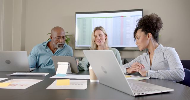 Diverse Team Collaborating on Business Project in Office Setting - Download Free Stock Images Pikwizard.com