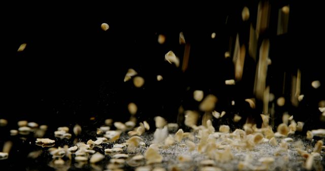 Close-up of oats falling on black background 4k