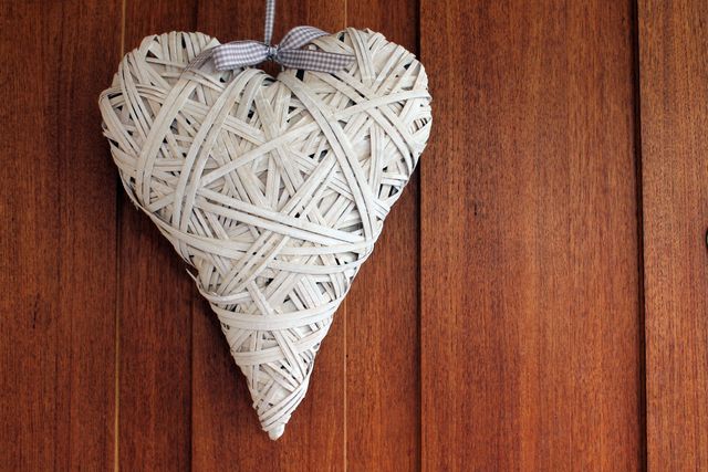 Handcrafted Heart Wreath against Wooden Background - Download Free Stock Photos Pikwizard.com