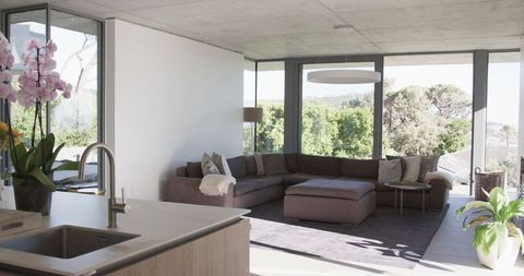 Minimalist Living Room with Garden Views and Cozy Sofa - Download Free Stock Images Pikwizard.com