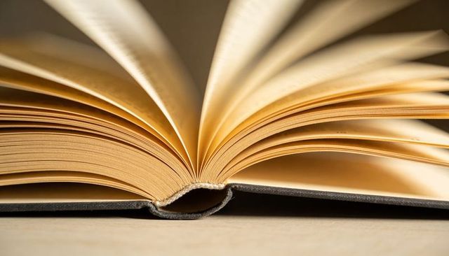 Open Hardcover Book Closeup Showing Sewn Spine, Cream Pages and Paper Texture