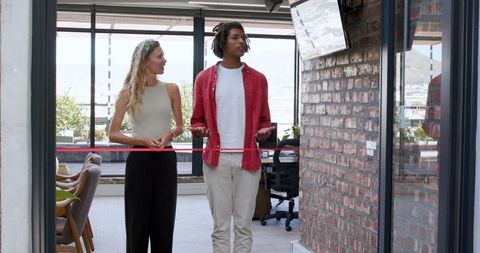 Colleagues Collaborating on Ideas in Open Office Space