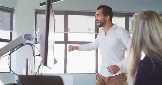 Happy Businessman Celebrating Successful Project in Modern Office - Download Free Stock Images Pikwizard.com