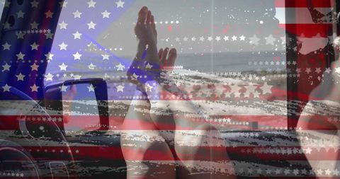 Relaxing road trip beach view with feet on dashboard and american flag overlay