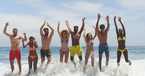 Diverse Group of Friends Celebrating on Beach in Swimwear - Download Free Stock Images Pikwizard.com