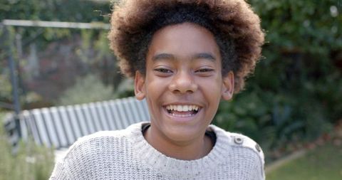 Joyful African American Boy Smiling Outdoors in Autumn