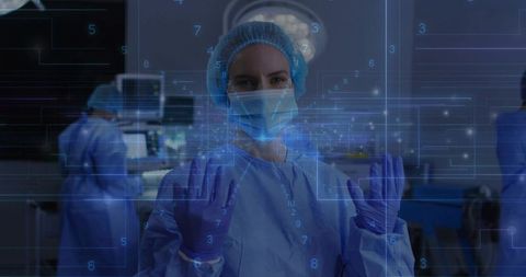 Lead surgeon manipulating holographic interface in OR wearing cap mask purple gloves