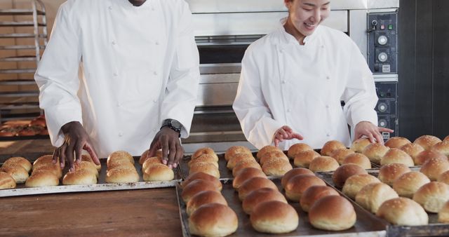 Multiracial bakers preparing fresh bread in a commercial kitchen - Download Free Stock Images Pikwizard.com