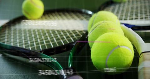 Close-Up of Tennis Rackets and Balls on Green Court