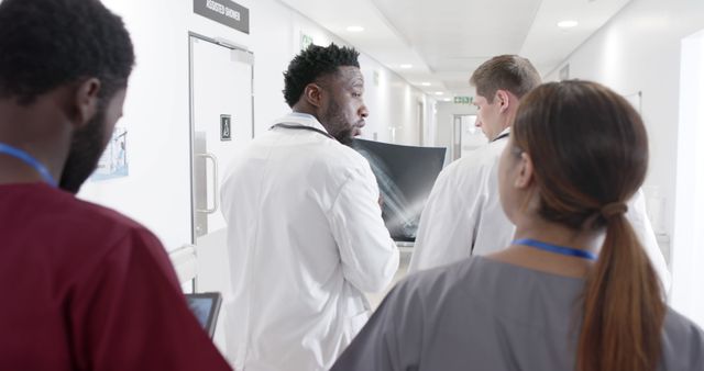 Medical Professionals Discussing Patient Health in Hospital Corridor - Download Free Stock Images Pikwizard.com