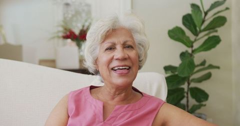 Smiling Senior Woman Joyfully Relaxing at Home