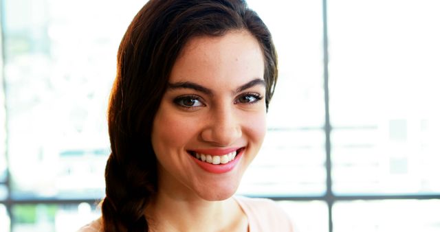 Smiling Young Woman with Braided Hair Indoors - Download Free Stock Images Pikwizard.com