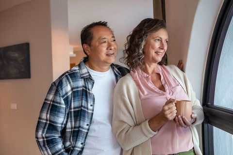 Senior Couple Relaxing at Home with Morning Coffee