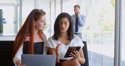 Diverse Colleagues Discussing Work with Digital Tablet in Corporate Office - Download Free Stock Images Pikwizard.com