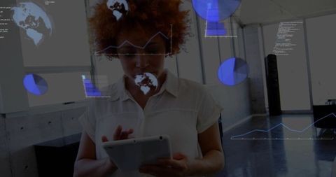 Woman using tablet with augmented data charts in modern office loft for tech presentations