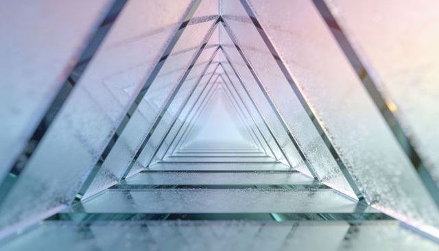 Triangular glass tunnel receding into frosted geometric corridor with reflective symmetry