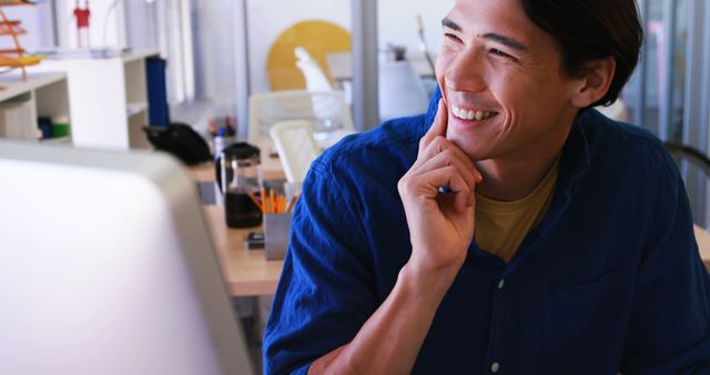 Smiling Man Planning at Desk in Modern Office - Download Free Stock Images Pikwizard.com