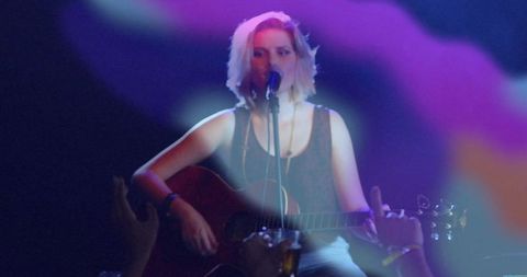 Teenage Musician Performing Live at Acoustic Concert