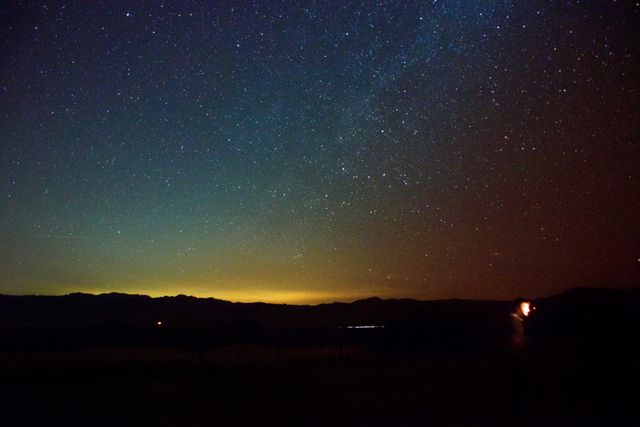 Starry Night Sky Over Mountain Ridge with Horizon Glow - Download Free Stock Photos Pikwizard.com