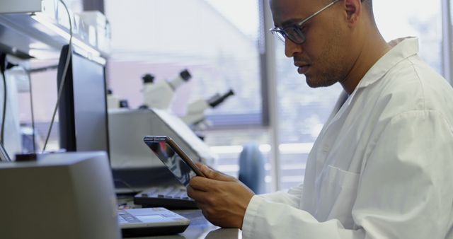 Scientist Analyzing Data on Tablet in Laboratory - Download Free Stock Images Pikwizard.com