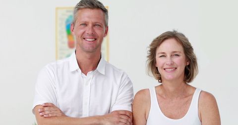 Smiling Middle-Aged Couple Enjoying Relaxed Atmosphere