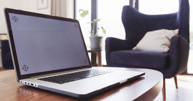 Modern Home Office with Laptop and Cozy Armchair on Wooden Table - Download Free Stock Images Pikwizard.com