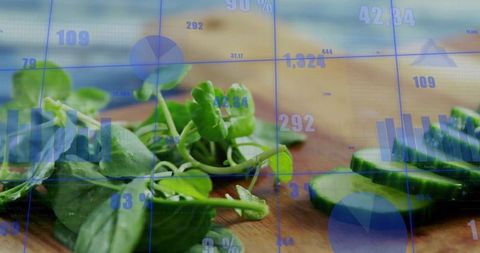 Fresh microgreens and sliced cucumber on wooden board with blue data analytics overlay