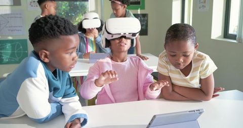 African American Children Exploring Virtual Reality in Classroom with Tablets and Headsets
