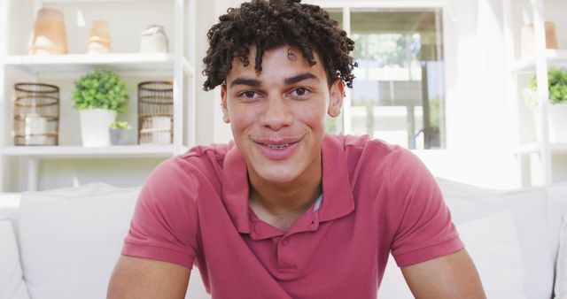 Smiling Young Man Relaxing on Modern Sofa at Home - Download Free Stock Images Pikwizard.com